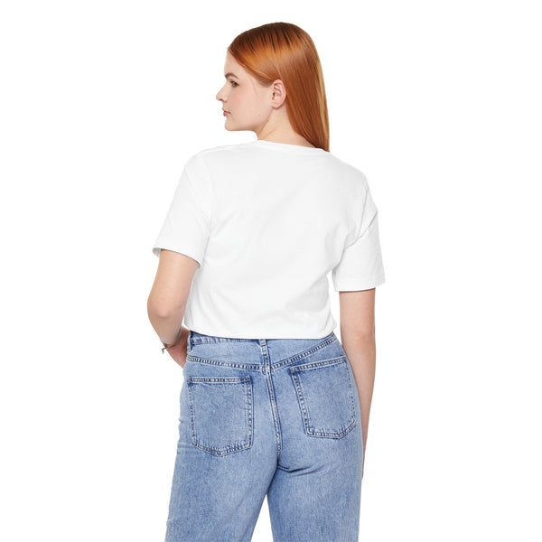 Person wearing a white t-shirt and light blue jeans on a white background